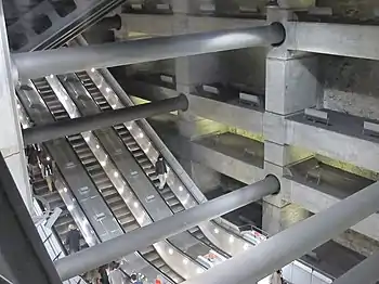 Image 20Escalators at Westminster Underground station descend between beams and columns of the station box to reach the deep-level Jubilee line platforms.