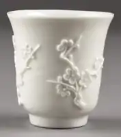 Chinese Dehua porcelain cup with prunus blossom, 17th century