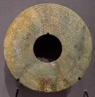 A Western Han dynasty Bi, with dragon designs, 4th-2nd century BC